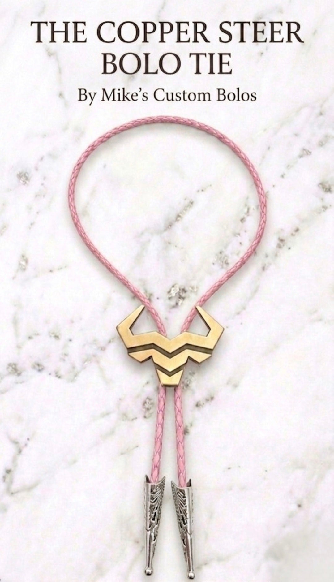 Copper Steer Bolo Tie with pink braided leather cord and engraved silver tips, Western fashion accessory for men and women.