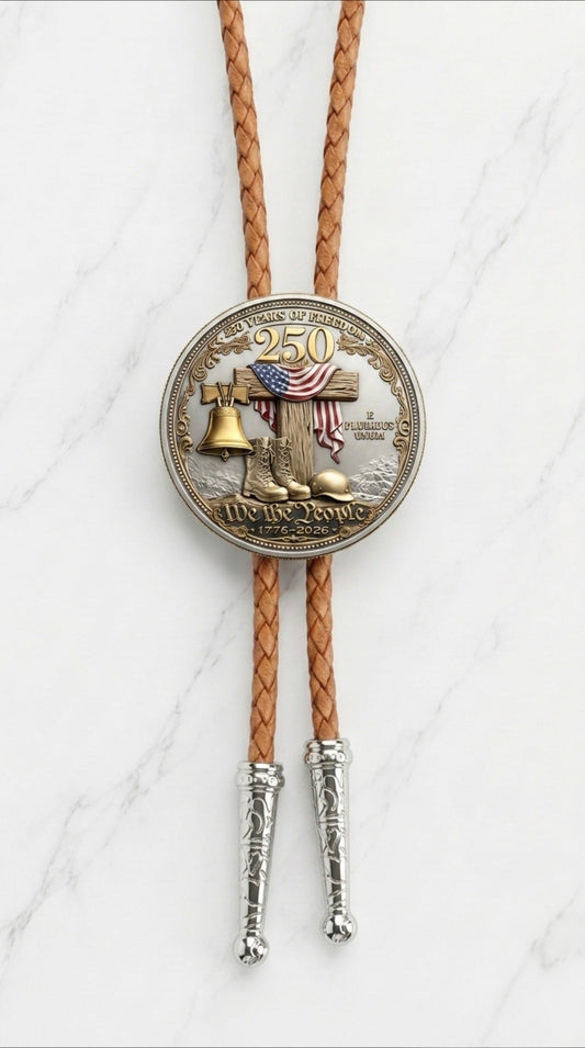 Honoring Our Veterans Bolo Tie Side A with Liberty Bell, American flag, military boots, helmet, We The People centerpiece, brown braided leather, and polished silver ornate tips