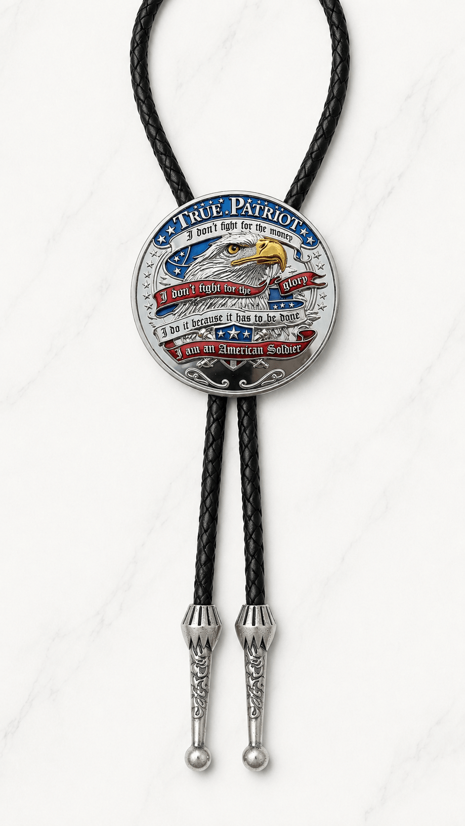 A True Patriot Bolo Tie Side A featuring an American bald eagle and the patriotic soldier's creed, "I don't fight for the money, I don't fight for the glory, I do it because it has to be done. I am an American Soldier," on premium black braided leather with polished silver engraved Western bolo tips.