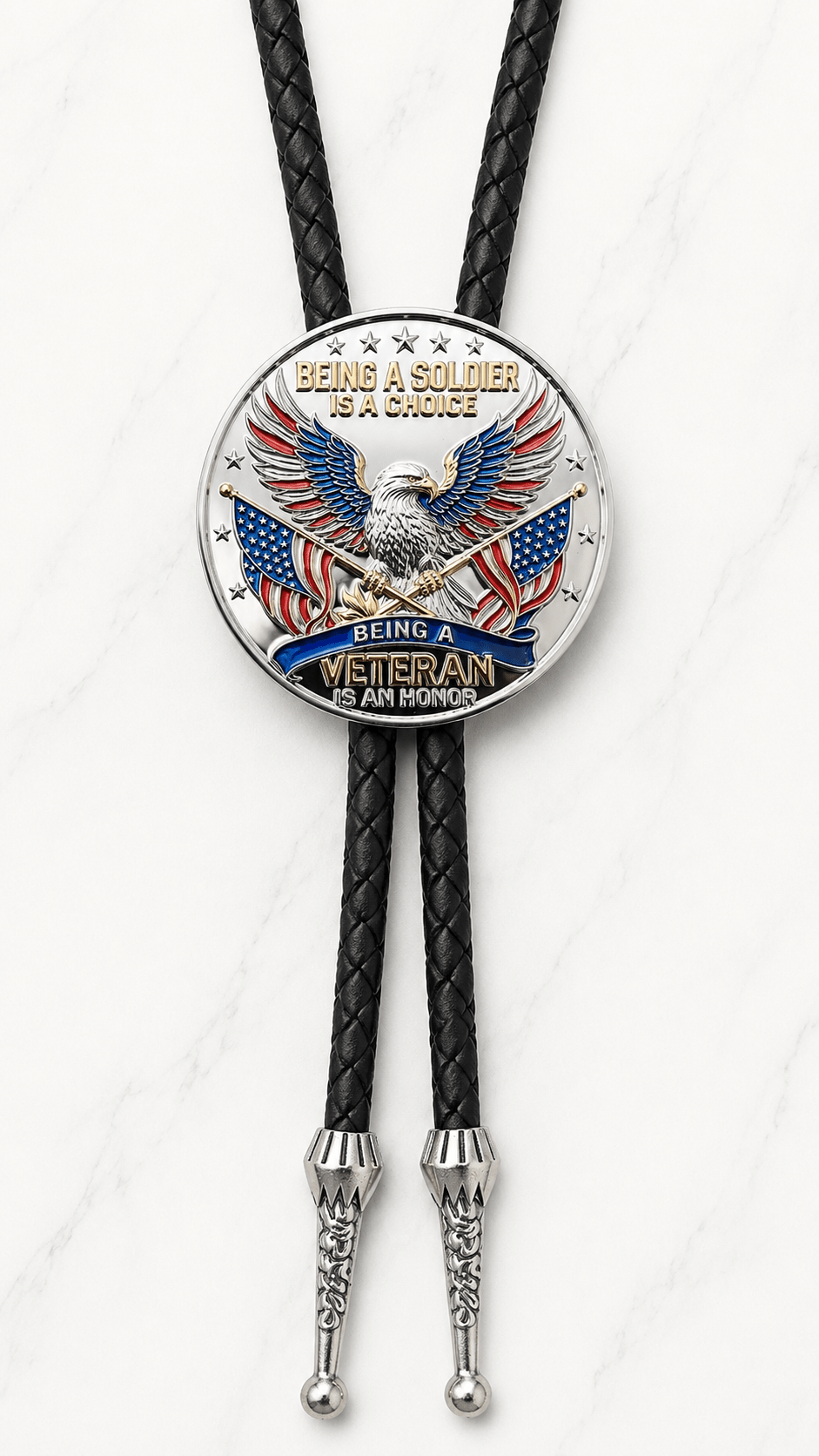 A True Patriot Bolo Tie Side B featuring a commemorative American eagle centerpiece with crossed American flags, premium black braided leather, and polished silver engraved Western bolo tips.
