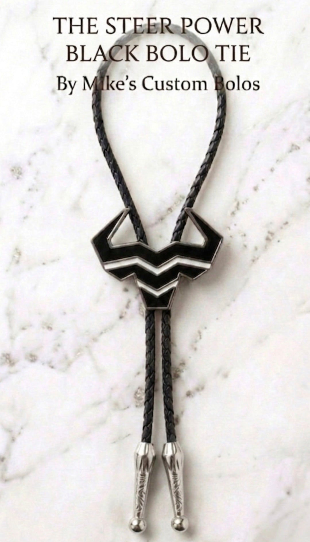 Black Steer Bolo Tie with black braided leather cord and silver engraved tips by Mike's Custom Bolos and Steer Hat Co.