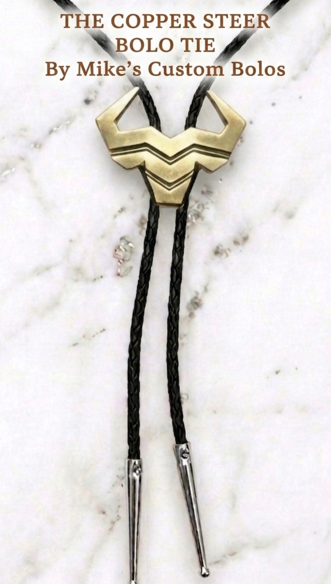 Copper Steer Bolo Tie with black braided leather cord and polished silver tips by Mike's Custom Bolos and Steer Hat Co.