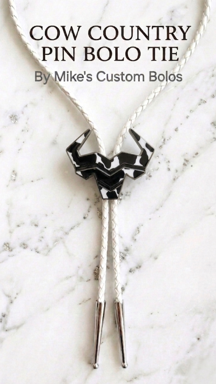 Cow country bolo tie on a white with silver marble background with text 'Cow Country Bolo Tie by Mike's Custom Bolos'.