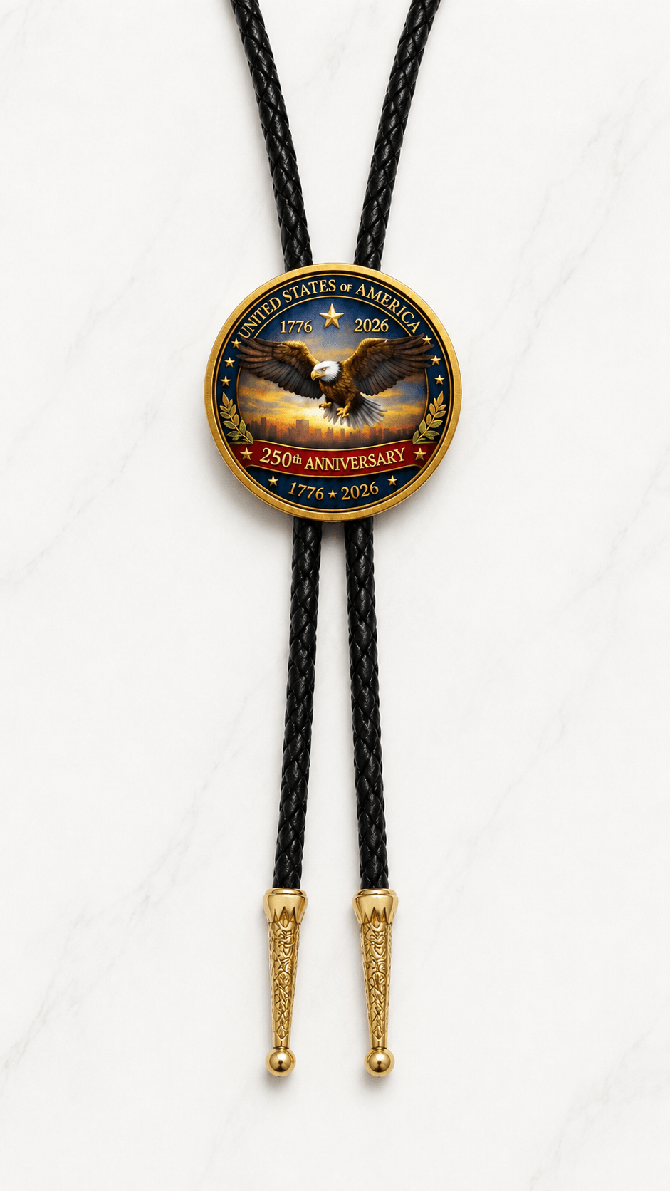 One Nation Under God Bolo Tie Side B featuring a soaring eagle commemorative coin centerpiece, black braided leather, and ornate gold-tone tips on white marble