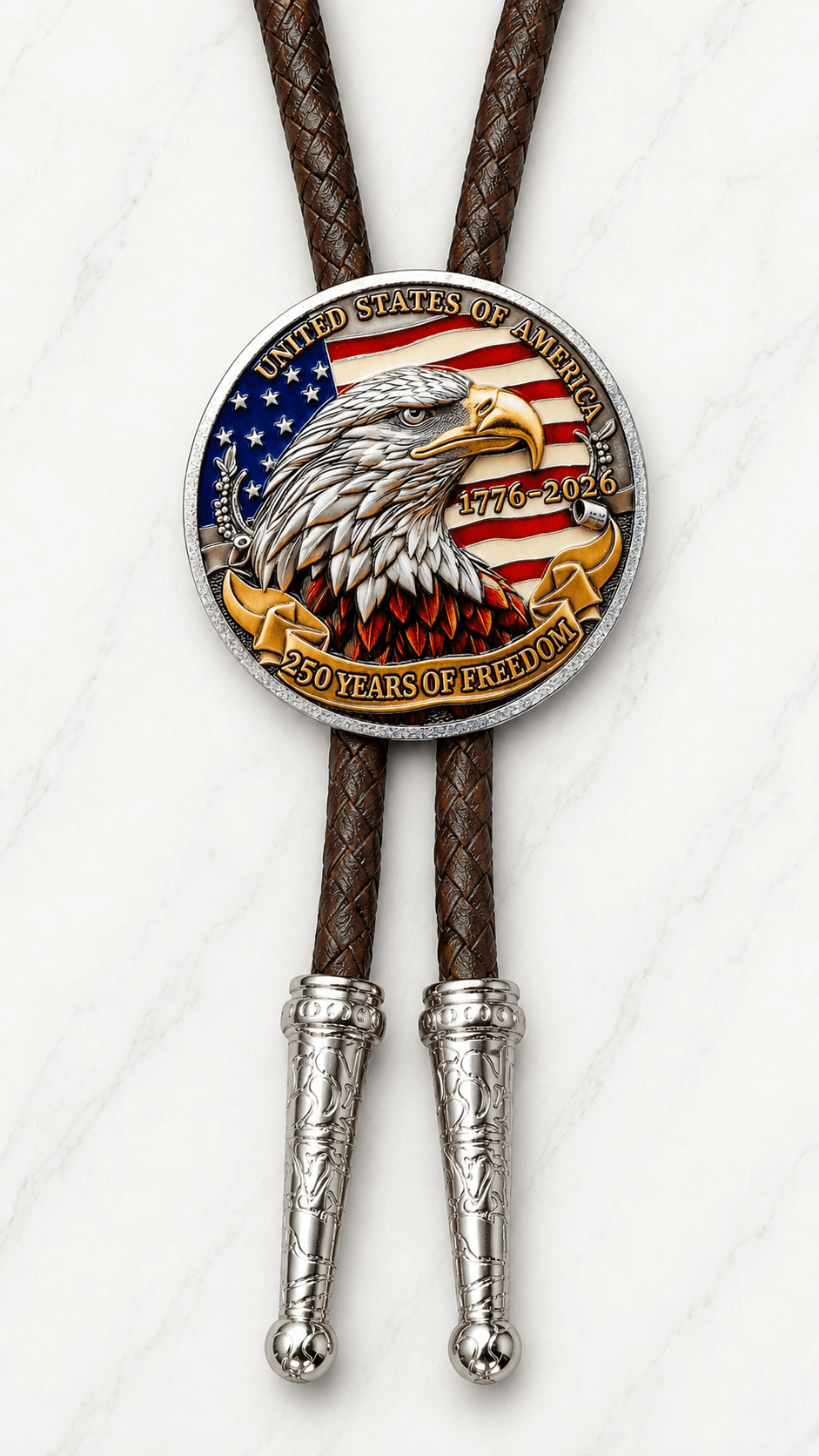 Reverse side of The Liberty Bell And American Eagle Bolo Tie featuring a bald eagle, American flag, 1776–2026 dates, 250 Years of Freedom lettering, brown braided leather, and silver-tone tips on white marble