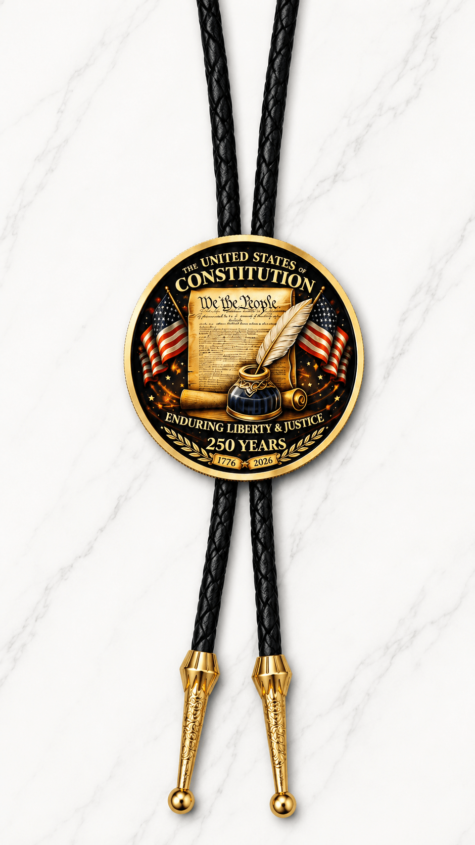 The U.S. Constitution Bolo Tie Side B featuring We the People Constitution artwork, two American flags, quill and inkpot, Enduring Liberty and Justice lettering, black braided leather, and ornate gold-tone tips on white marble